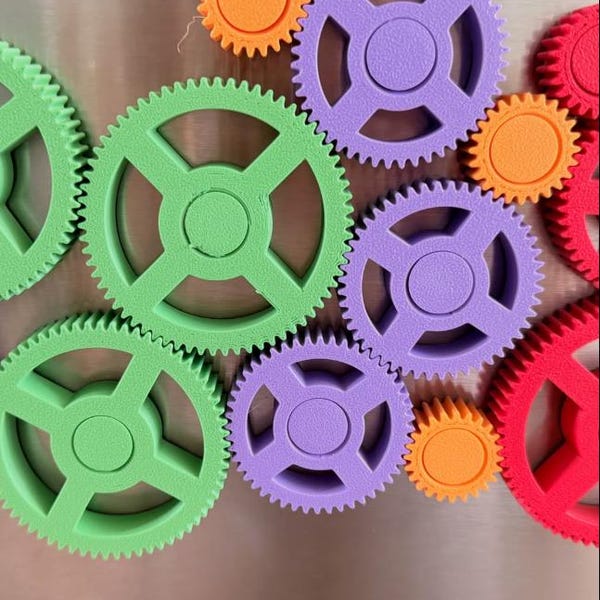 Colourful spinning gears fridge magnet